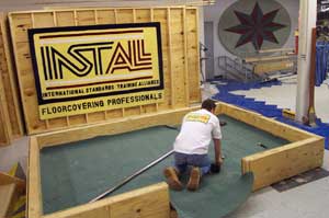 An apprentice practices installation techniques at the Elk Grove training facility